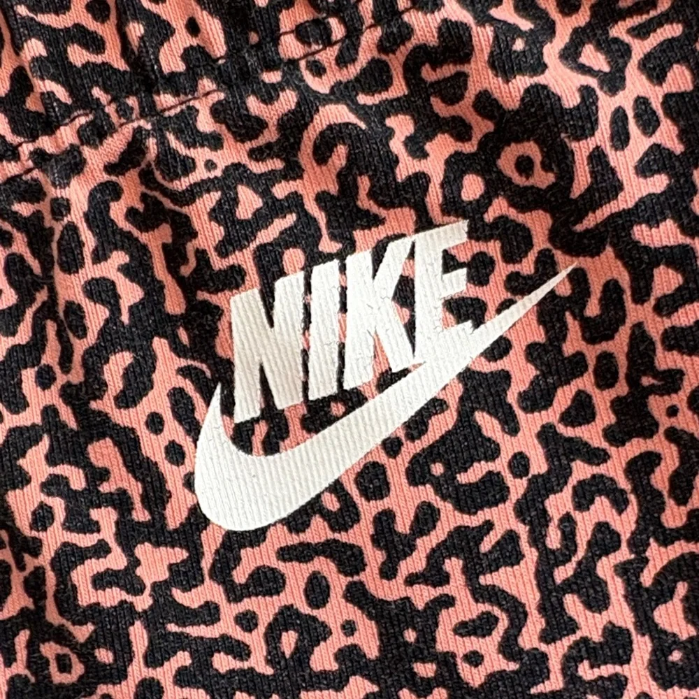 Nike Women's Orange and Black Patterned Full Length Leggings